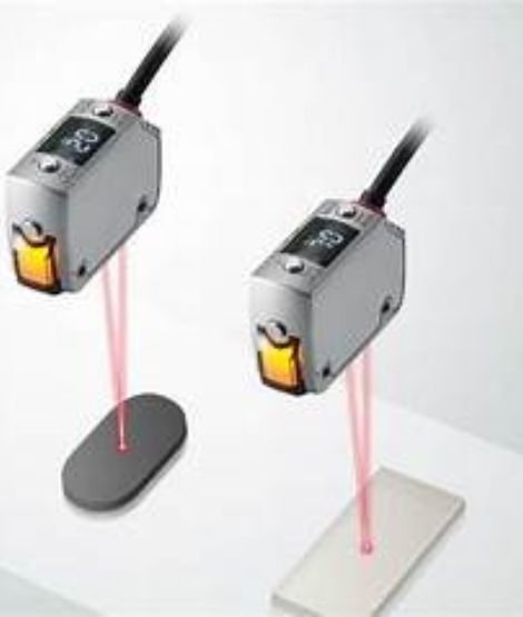 A compact laser sensor used for object detection in automation